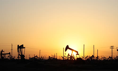 Oil rigs extract raw petroleum from the Earth.