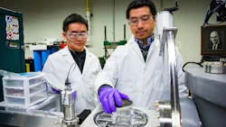 Sichuang Xue (left) Purdue postdoctoral research associate and Qiang Li (right), Purdue doctoral student preparing a sample to create super-strong aluminum alloys (image courtesy of Purdue).