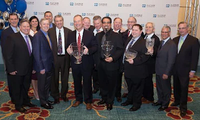 PPG and Painters Supply & Equipment Company representatives celebrate the 2017 Platinum Distributor of the Year Award.