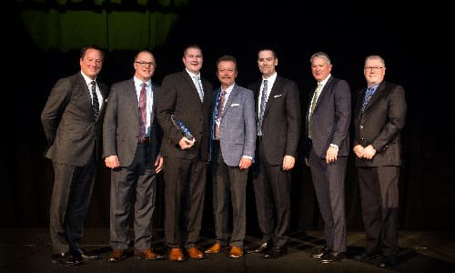 The BBB Industries team accepting their award.