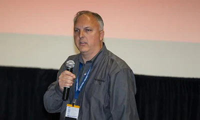 Mark Zoba speaks at a conference. Nissan has recently announced that it will add and improve partnerships between key industry people.
