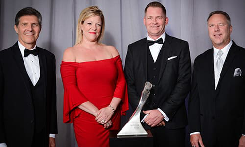 GM Executives with Shawn McMahon, president Day & Ross Dedicated Logistics (second from right) and spouse Tracy.