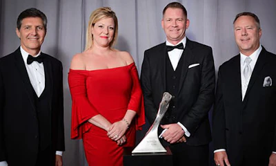 GM Executives with Shawn McMahon, president Day & Ross Dedicated Logistics (second from right) and spouse Tracy.
