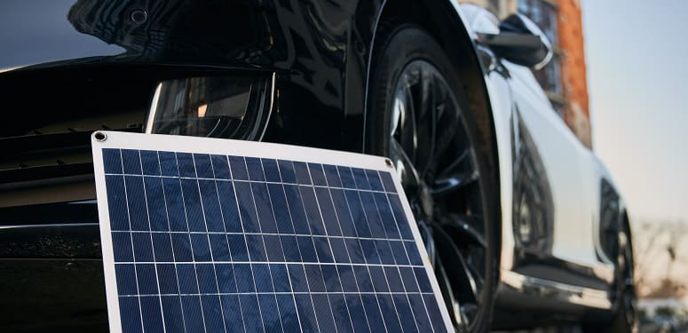 Solar panel and electric car on the street.