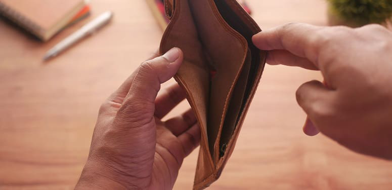 Man hand open an empty wallet with copy space.