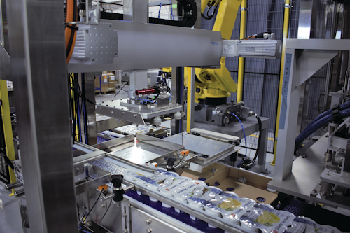 A high-speed linear gantry replaced the delta-style robot commonly used by Nuspark in tray-loading applications like these.