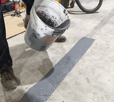 Application of a semi-rigid aggregate to a concrete joint for repair.