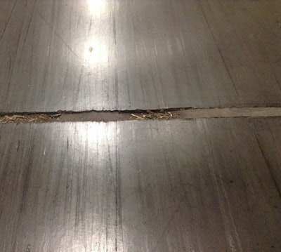 Example of a concete joint filler punched down due to improper depth.