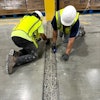 Concrete contractors widened a structural joint for repair.
