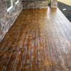 Stamped concrete mimicking natural wood delivers the look of timber with the durability of concrete.