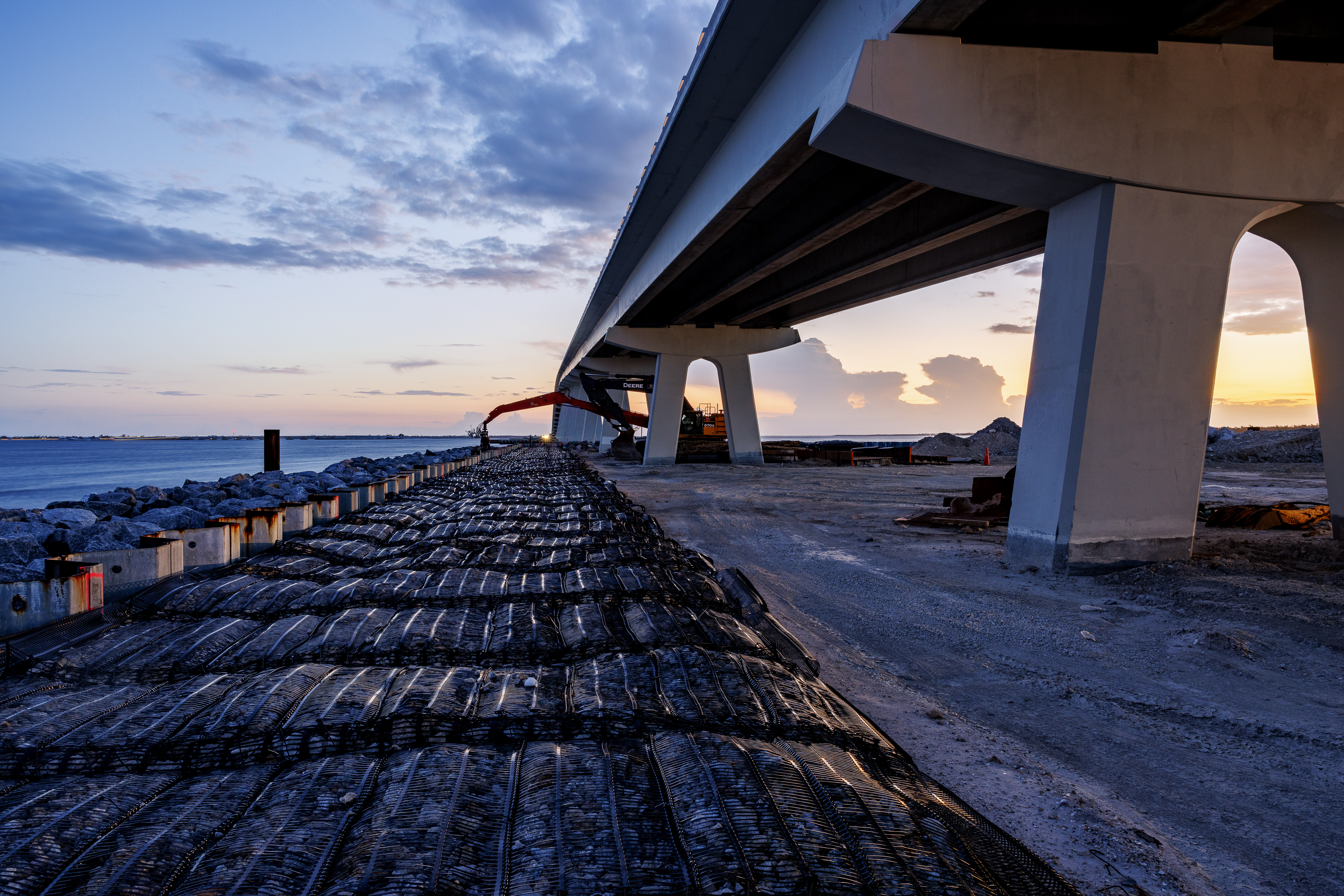 Gabion marine mattresses (25,225 square yards) await installation for scour protection.