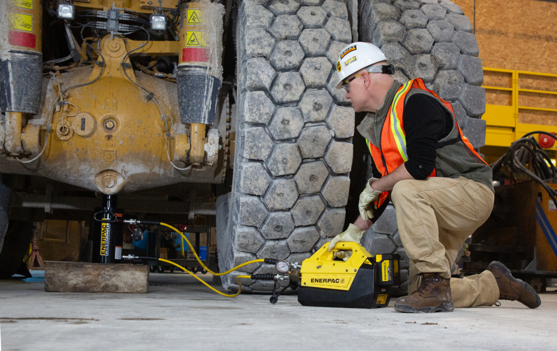 Enerpac XC2 battery powered pump makes quick work of jacking construction and mining vehicles.
