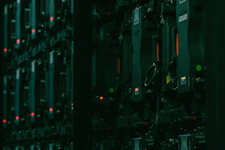Electronic equipment panel with illuminated red and green indicator lights. | Photo by Matthieu Beaumont