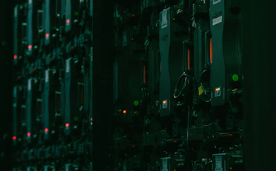 Electronic equipment panel with illuminated red and green indicator lights. | Photo by Matthieu Beaumont