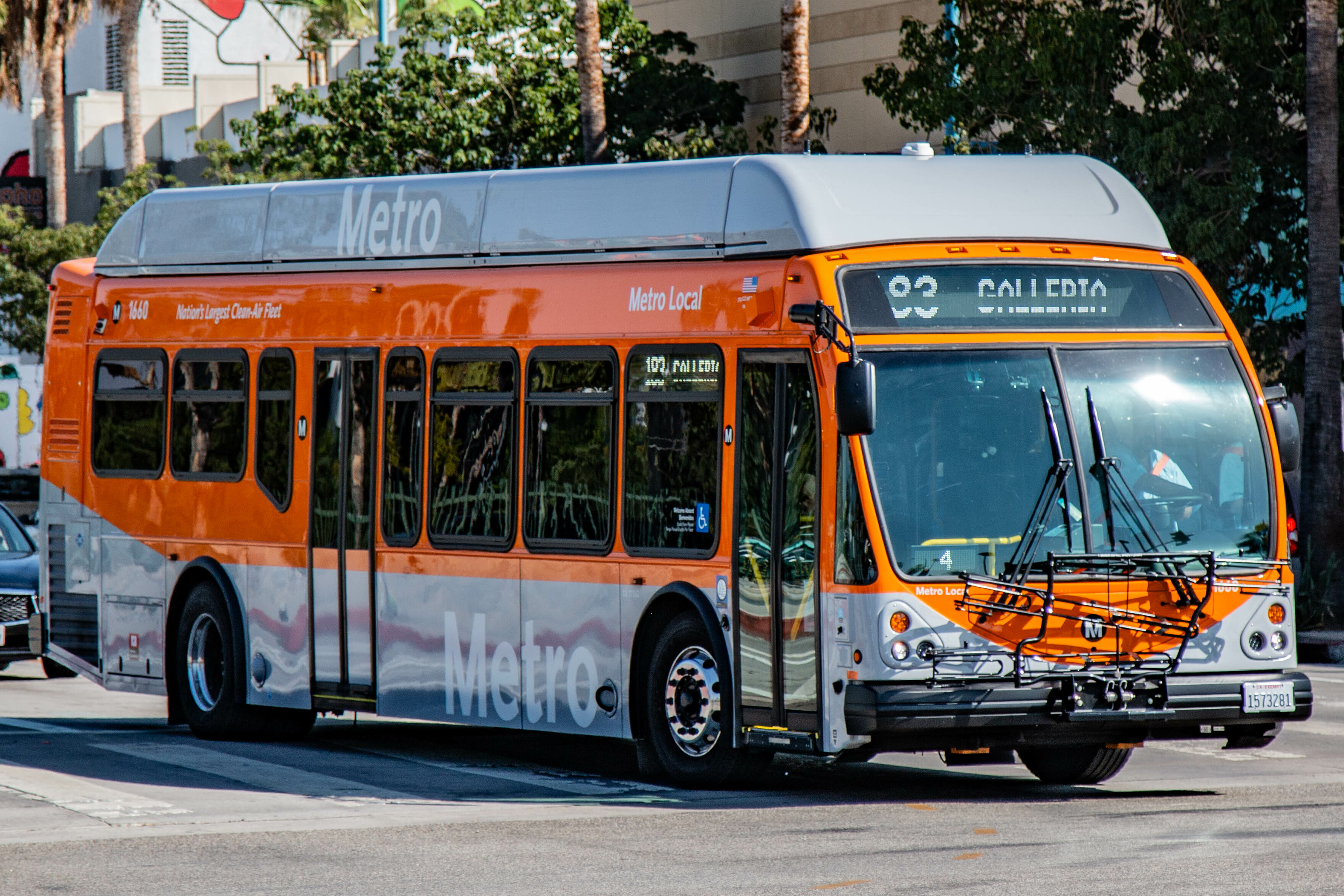 Orange and white LA Metro bus with route 23 to Galleria displayed on street