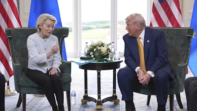President Donald Trump and European Commission President Ursula von der Leyen speak as they meet at the Trump Turnberry golf course in Turnberry, Scotland Sunday, July 27, 2025.