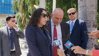Neima Benavides, whose sister died in a Florida crash involving Tesla’s Autopilot driver assist technology, speaks to reporters outside the federal courthouse in Miami, Friday, Aug. 1, 2025.