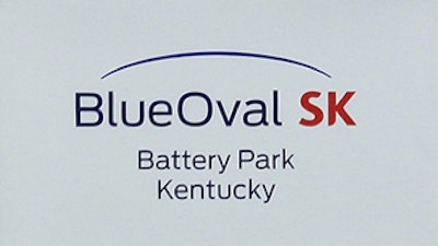 Logos for BlueOval SK and Ford are displayed on a podium during a celebration for the progress of the BlueOval SK Battery Park in Glendale, Ky., Dec. 5, 2022.