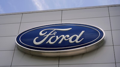 The Ford logo is seen above the entrance to the Ford Motor Company Kentucky Truck Plant, April 30, 2025, in Louisville, Ky.