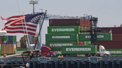 Shipping containers sit stacked at the Evergreen terminal at the port of Los Angeles, Friday, Aug. 1, 2025.