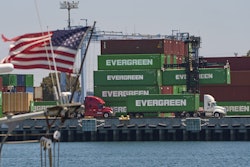 Shipping containers sit stacked at the Evergreen terminal at the port of Los Angeles, Friday, Aug. 1, 2025.
