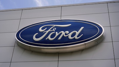 The Ford logo is seen above the entrance to the Ford Motor Company Kentucky Truck Plant, April 30, 2025, in Louisville, Ky.