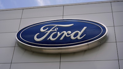 The Ford logo is seen above the entrance to the Ford Motor Company Kentucky Truck Plant, April 30, 2025, in Louisville, Ky.