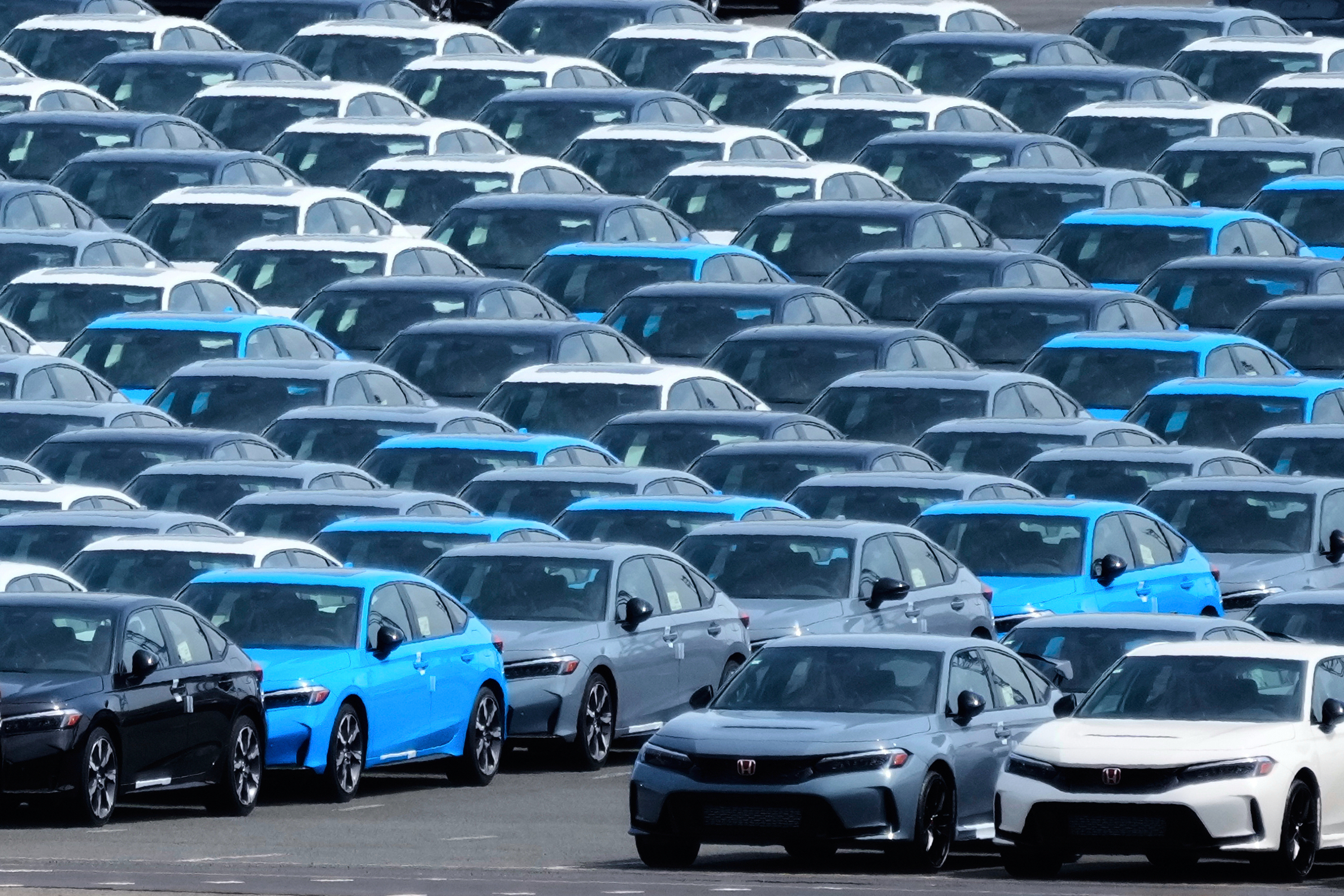 Export vehicles are parked at Daikoku Pier in Yokohama, near Tokyo, April 8, 2025.