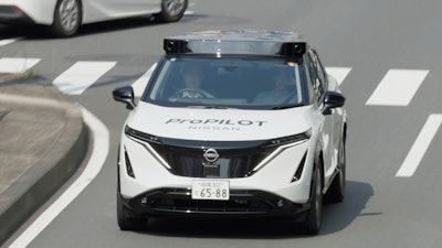 In this image made from video provided by Nissan Motor Co., Japanese automaker Nissan's test vehicle featuring an automated driving system packed with artificial intelligence moves on a road in Tokyo on September, 2025.