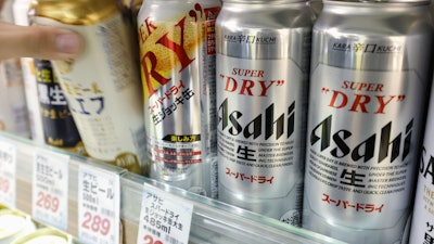 Cans of beer sit on a shelf at a supermarket in Yokohama, near Tokyo Friday, Oct. 3, 2025.