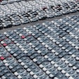 New cars for export wait for shipment at a port in Shanghai, China on May 11, 2025.