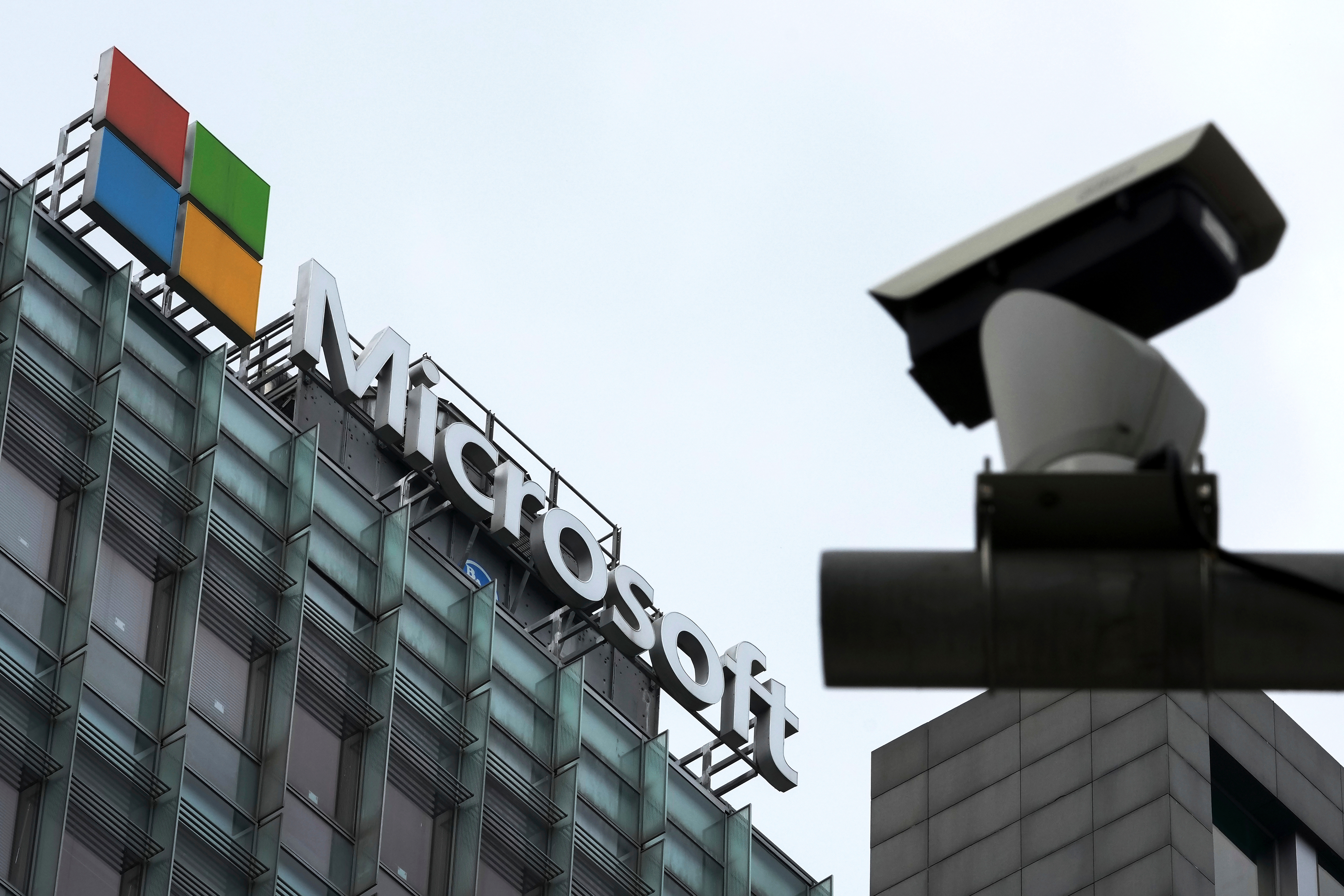 A security surveillance camera is seen near the Microsoft office building in Beijing, July 20, 2021.