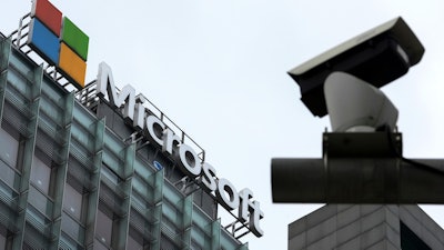 A security surveillance camera is seen near the Microsoft office building in Beijing, July 20, 2021.