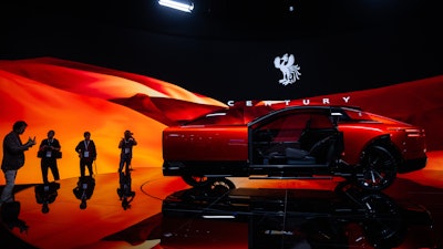 Members of the media and guests look at a Century's concept model during the press day of the Japan Mobility Show, in Tokyo, Thursday, Oct. 30, 2025.
