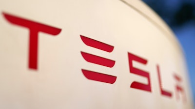 The logo for the Tesla Supercharger station is seen in Buford, Ga, April 22, 2021.