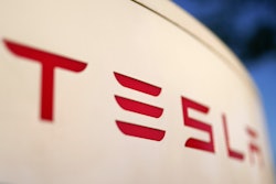 The logo for the Tesla Supercharger station is seen in Buford, Ga, April 22, 2021.