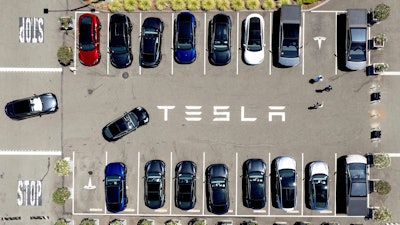 Tesla vehicles line a parking area at the company's Fremont, Calif., factory, Aug. 5, 2025.