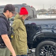 Detroit Police Commercial Theft Section Officer Ibrahim Kakish takes a Ford employee into mock custody during a demonstration Wednesday of how the automaker is using technology to fight thefts of its F-150 pickups and F-250 Super Duty pickups on Wednesday, Dec. 10, 2025.