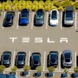 Tesla vehicles line a parking lot at the company's Fremont, Calif., factory on Aug. 5, 2025.