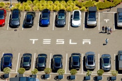 Tesla vehicles line a parking lot at the company's Fremont, Calif., factory on Aug. 5, 2025.