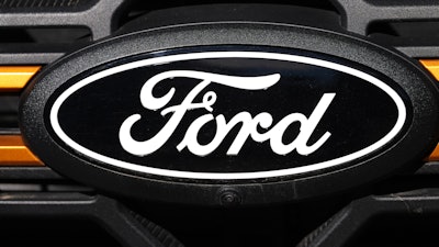 The company logo is shown on the grille of an unsold 2026 F-series pickup truck on the lot of a Ford dealership, Sunday, Nov. 2, 2025, in Littleton, Colo.