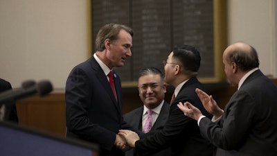 Virginia Gov. Glenn Youngkin with Bon-Kyu Koo President & CEO, LS Cable & System; (background) Paul Dabbar, U.S. Deputy Secretary of Commerce, and Patrick Y. Shim, Managing Director, LS Cable & System