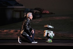 Nvidia founder and CEO Jensen Huang kneels in front of a robot during a Nvidia news conference ahead of the CES tech show Monday, Jan. 5, 2026, in Las Vegas.
