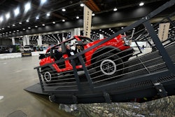 Guests are given a ride in a Bronco on a track at the Detroit Auto Show, Friday, Jan. 10, 2025, in Detroit.