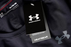 The company logo graces a sales tag on a compression shirt for sale in an Under Armour store in an outlet mall on May 3, 2021, in Lakewood, Colo.