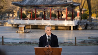 Canada's Prime Minister Mark Carney, speaks to the media at Ritan Park in Beijing, China, Friday, Jan. 16, 2026.
