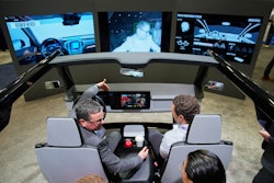 People experience a Gentex Corporation driver and in-camera monitoring system exhibit during the CES tech show Tuesday, Jan. 6, 2026, in Las Vegas.