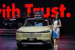 A model poses near a Honda HR-V car during the Indonesian International Motor Show in Jakarta, Indonesia, Thursday, Feb. 5, 2026.