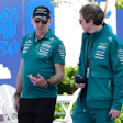 Aston Martin team principal Adrian Newey, left, talks with a team member as he arrives at the track ahead of the Australian Formula One Grand Prix at Albert Park, in Melbourne, Australia, Thursday, March 5, 2026.
