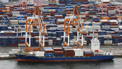 Containers are stacked at a port in Yokohama, near Tokyo on Aug. 1, 2025.